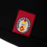 Load image into Gallery viewer, tee shirt has bright red patch with the dave&#39;s hot chicken logo stitched
